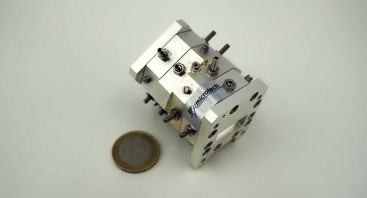 Low loss Ku-band bandpass filter with wide spurious free response